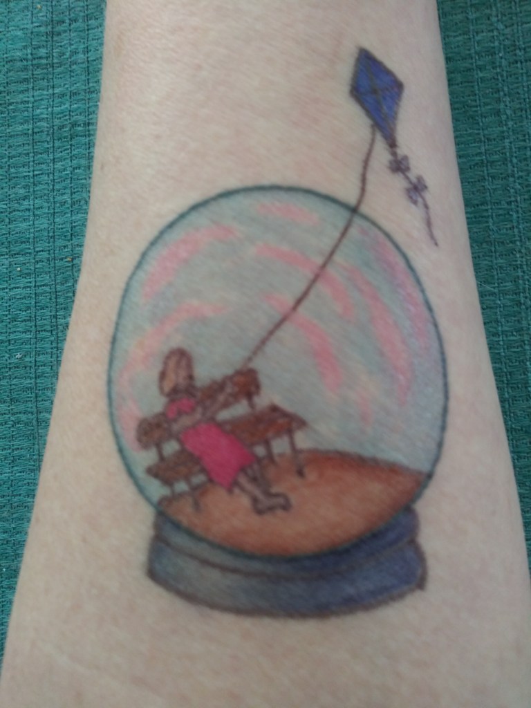Girl in snow globe with kite